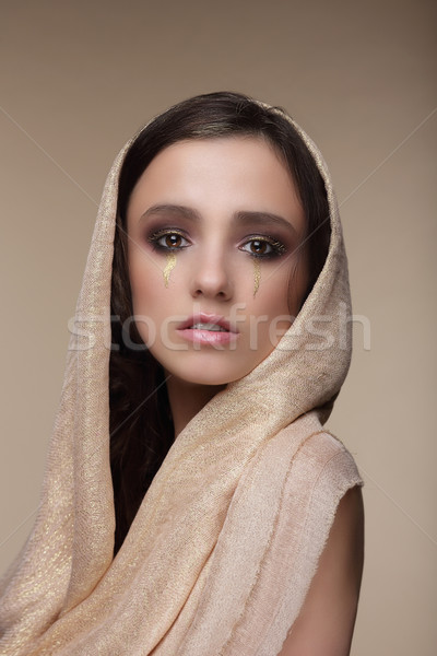 Stylization. Woman with Golden Tears. Art Makeup Stock photo © gromovataya