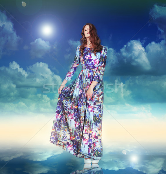 Imagination. Woman in Light Dress is Hovering among Clouds Stock photo © gromovataya