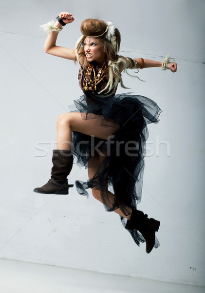 Tribe. Wild tribal person jumping - retro style. Antique Stock photo © gromovataya