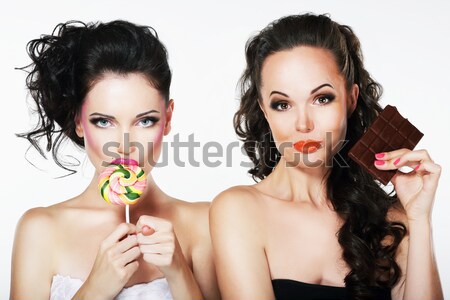 Dos hermosa mujeres dulces pirulí Foto stock © gromovataya