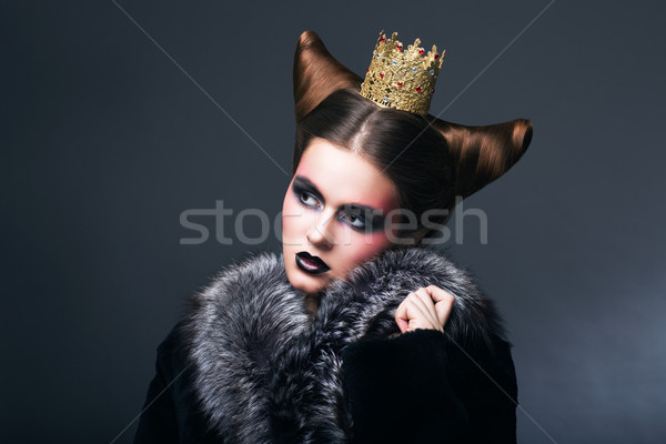 Stylized Woman in Fur Coat and Gold Grown. Nostalgia Stock photo © gromovataya