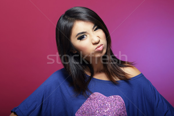 Antipathy. Discontented Asian Woman Grimacing Stock photo © gromovataya