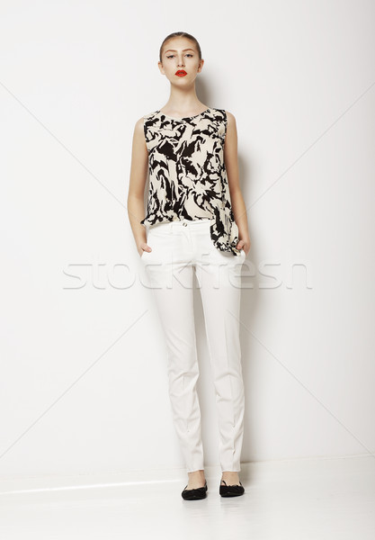 Stock photo: Stylish Young Woman Mod in Light Clothes over White Background. Fashion Style