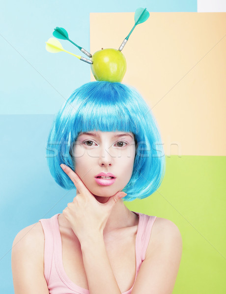 Creativity. Woman with Painted Blue Hairs and Apple on her Head Stock photo © gromovataya