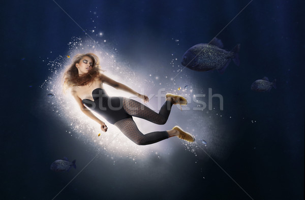 Creativity. Fantasy. Woman is Diving in Water Stock photo © gromovataya