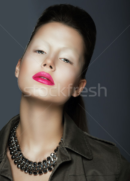 Vogue Style. Sophisticated Woman with Trendy Makeup and Necklace Stock photo © gromovataya