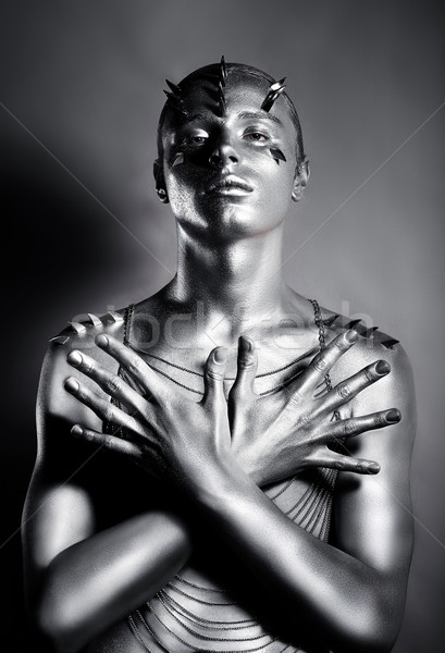 Man with Crossed Hands in Artistic Pose. Conceptual Design. Creativity Stock photo © gromovataya