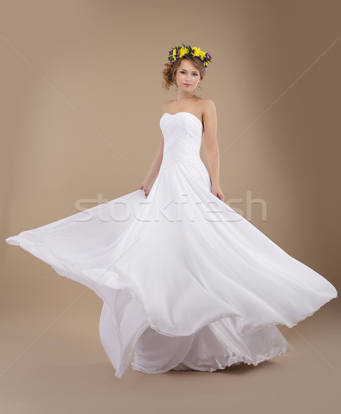 Beautiful Fiancee with Vernal Wreath of Flowers in Flying Wedding Dress Stock photo © gromovataya