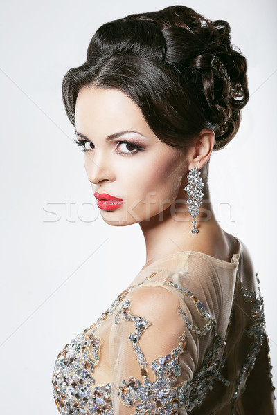 Prosperity. Luxury. Glamorous Showy Woman with Diamond Earrings Stock photo © gromovataya