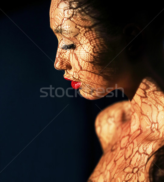 Art Deco. Ethnic Woman's Face with Reflex of Openwork Lace - Fancy Makeup Stock photo © gromovataya