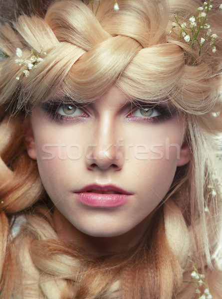 Closeup Portrait of Young Woman with Tress and Flowers Stock photo © gromovataya