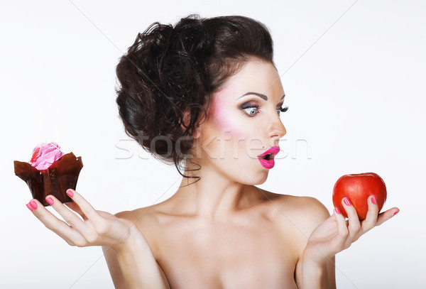 Surprised Funny Woman Decides between Apple and Cake Stock photo © gromovataya