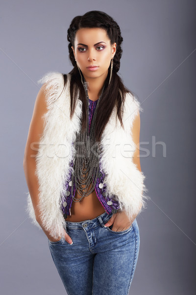 Stylish Young Woman in Modern Furry Jacket and Jeans Stock photo © gromovataya