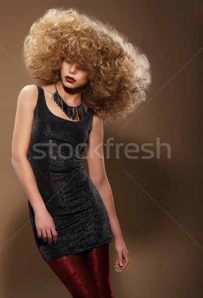 Vogue Style. Stylish Woman with Extravagant Hairstyle Stock photo © gromovataya