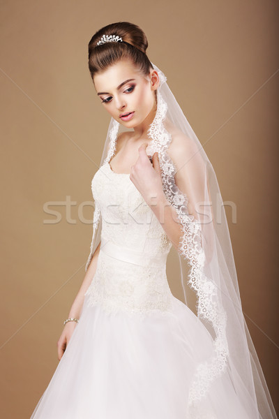 Femininity. Sentimental Bride in White Dress and Openwork Veil Stock photo © gromovataya