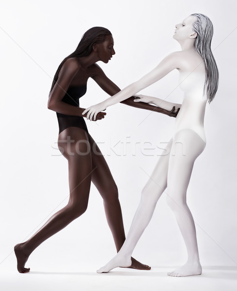 Two Styled Enigmatic Women Colored White and Brown Dancing Stock photo © gromovataya
