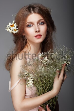 Meditation. Barefoot Genuine Woman with Bouquet of Flowers Stock photo © gromovataya