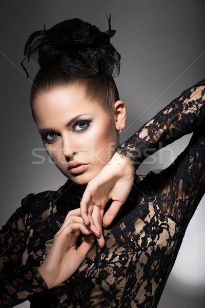 Glamor. Luxurious Woman in Black Dress and Bow. Sophistication Stock photo © gromovataya