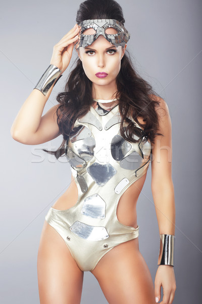 Splendor. Ultramodern Woman with Metallic Mask in Trendy Costume Stock photo © gromovataya