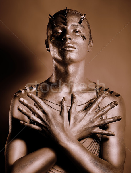 Stock photo: Coloring. Bodyart. Bronze Painted Man's Body in Shadow. Grace