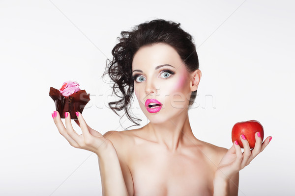 Dieting. Unsure Bewildered Girl Choosing Apple or Cake Stock photo © gromovataya