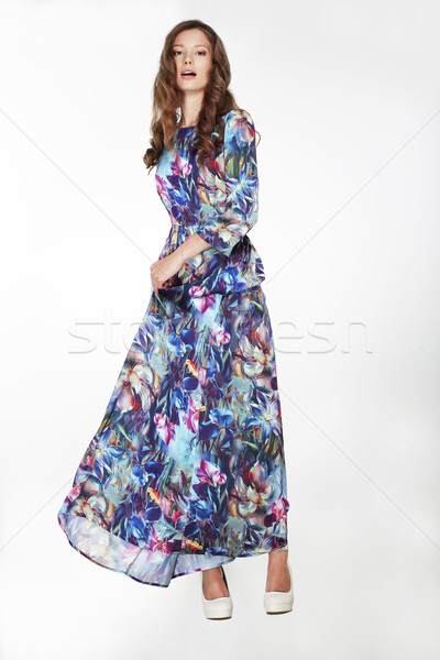 Elegant Fashionable Female in Silky Blue Flowery Dress Stock photo © gromovataya