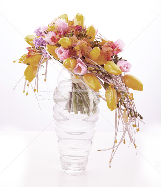 Colorful flower arrangement in glass vase with yellow tulips Stock photo © gromovataya