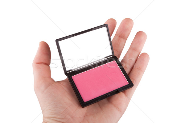 Női kéz tart rózsaszín bőrpír izolált Stock fotó © gsermek