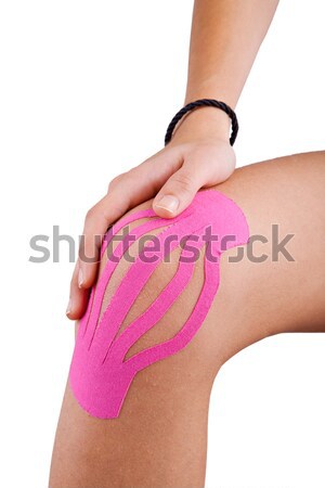 Knee treated with kinesio tex tape therapy Stock photo © gsermek