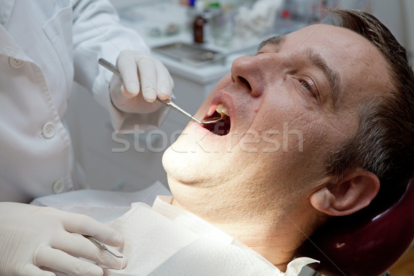 Stock photo: Man at the dentist office