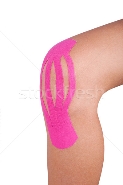 Stock photo: Knee treated with kinesio tex tape therapy