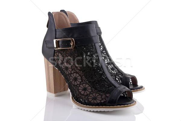 Female shoes with black lace, white sole and a wooden heel, isol Stock photo © gsermek