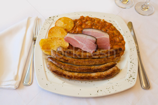 Homemade sausage from the tavern with beans and potatoes Stock photo © gsermek