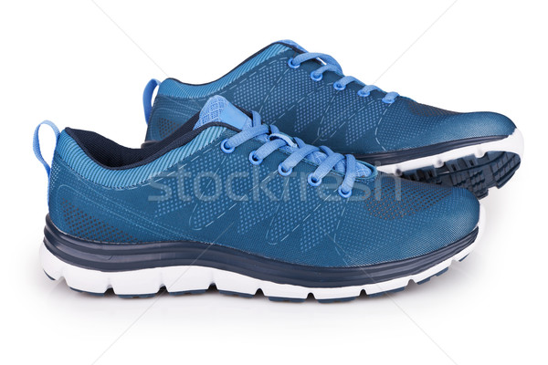 Blue sneakers with shadow isolated on white Stock photo © gsermek