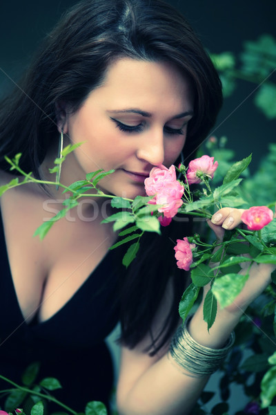 Romantic portrait of a girl smelling roses  Stock photo © gsermek