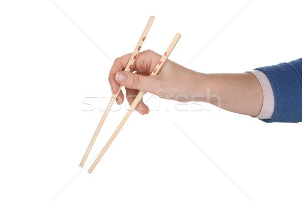 Female hand holding chopsticks with chinese inscription Stock photo © gsermek