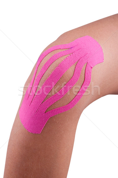 Knee treated with kinesio tex tape therapy Stock photo © gsermek