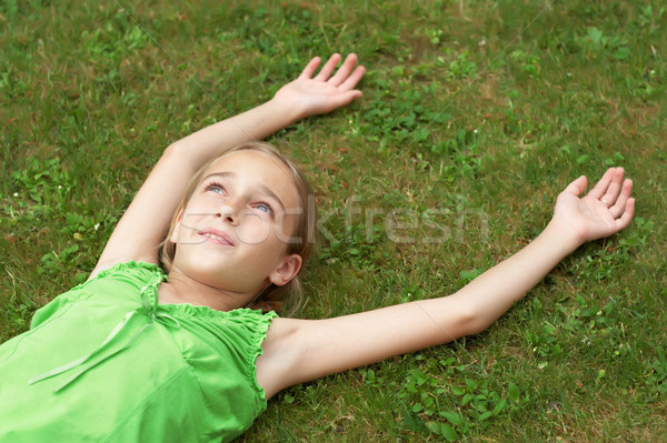 Young girl laying in the grass Stock photo © gsermek