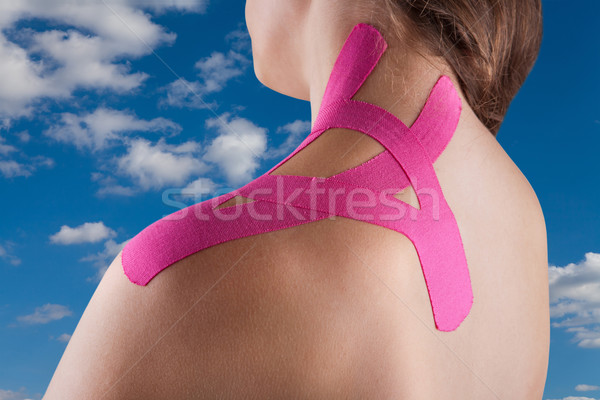 Therapy with kinesio tex tape against a blue sky Stock photo © gsermek