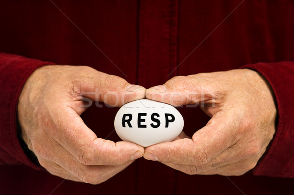 Man holds white egg with RESP written on it Stock photo © Habman_18