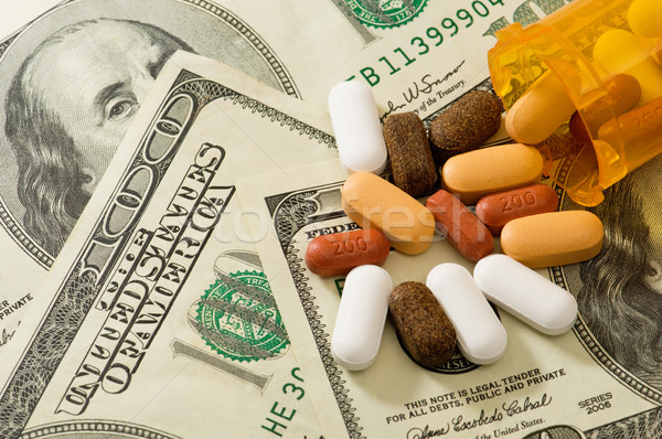 Pills spilled over American money Stock photo © Habman_18