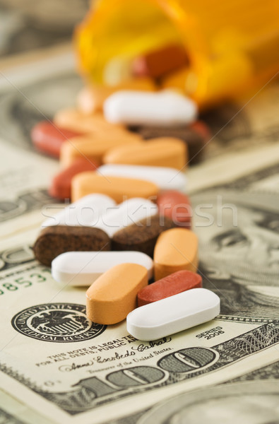 Pills spilled over money Stock photo © Habman_18