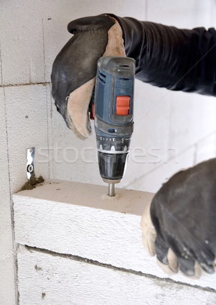 Murarz baterii śrubokręt wiercenie śruby konkretnych Zdjęcia stock © hamik
