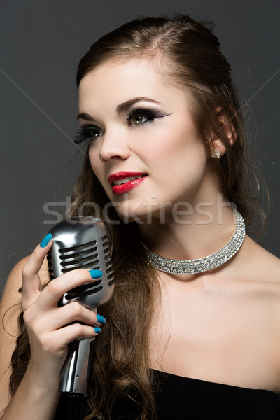 Beautiful female singer Stock photo © handmademedia