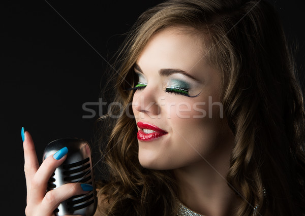 Beautiful female singer Stock photo © handmademedia