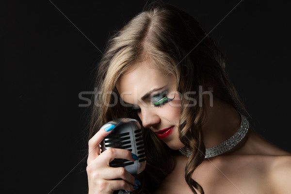 Beautiful female singer Stock photo © handmademedia