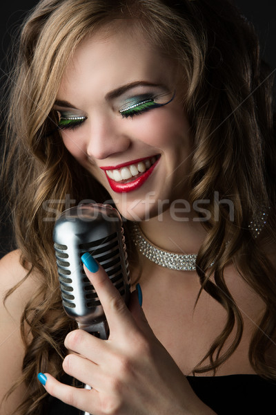 Beautiful female singer Stock photo © handmademedia