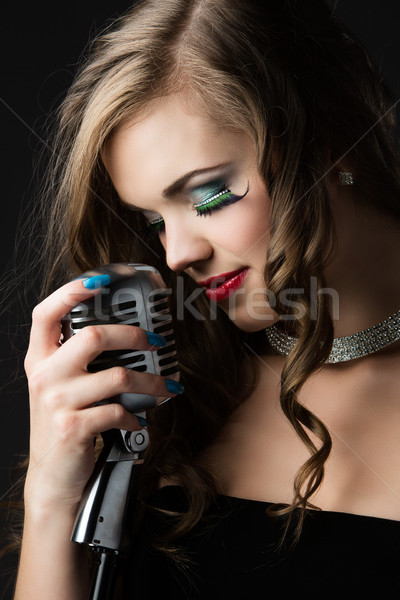 Beautiful female singer Stock photo © handmademedia