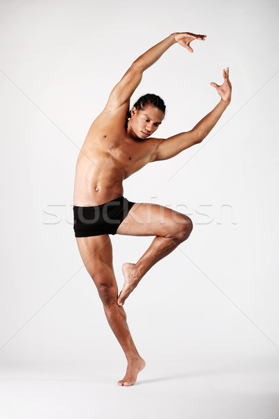 Jóvenes masculina bailarín posando gris mano Foto stock © hannamonika