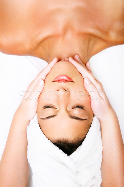 Mooie glimlachende vrouw massage handen gezicht Stockfoto © hannamonika
